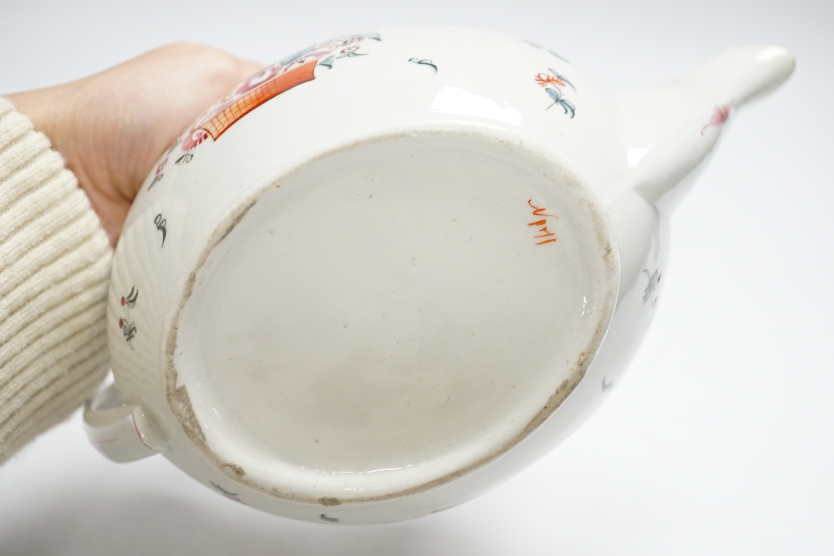 A Newhall porcelain boat shaped teapot, c.1800 with floral decoration, 25cm wide